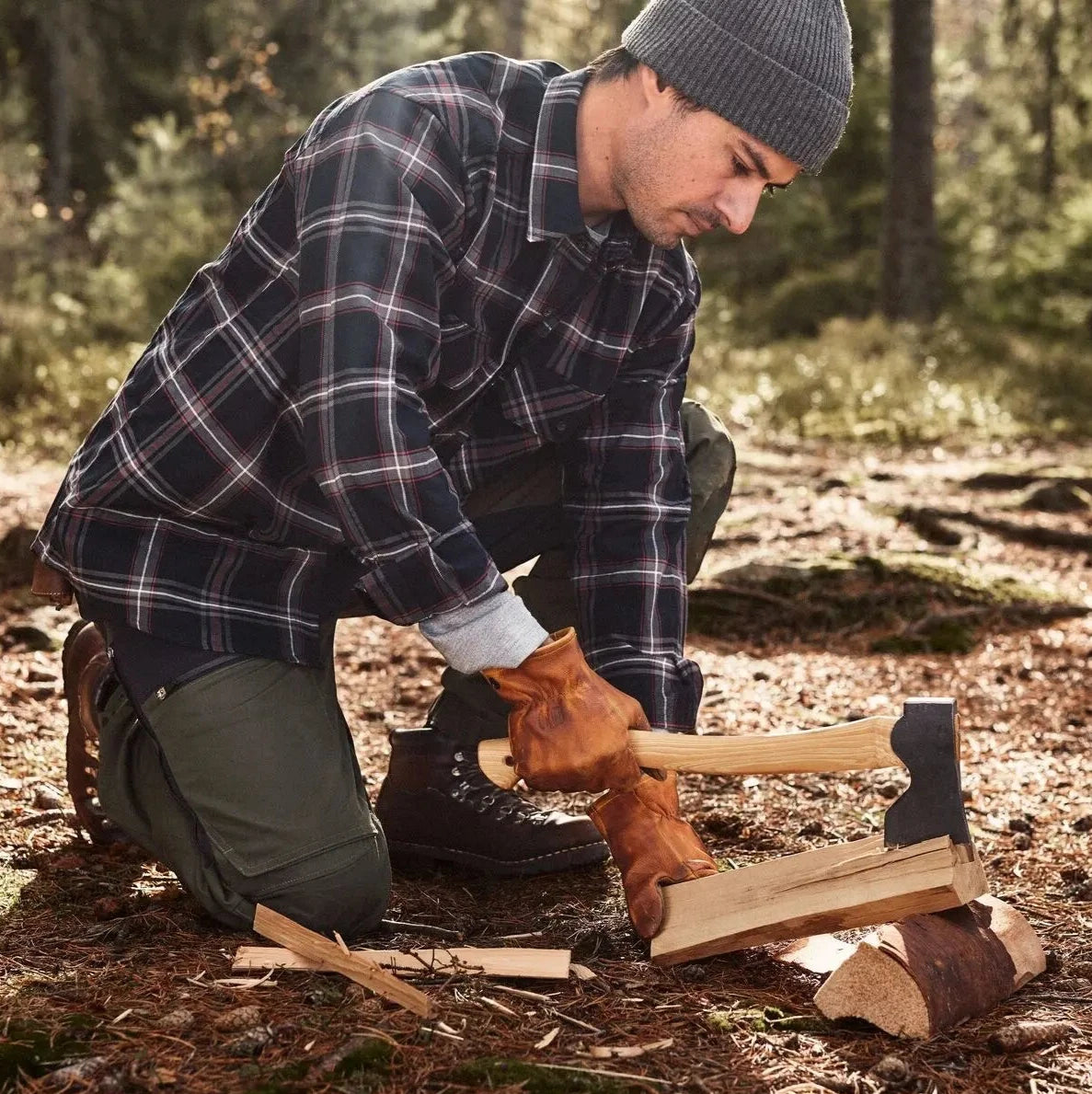 Splitting kindling with axe